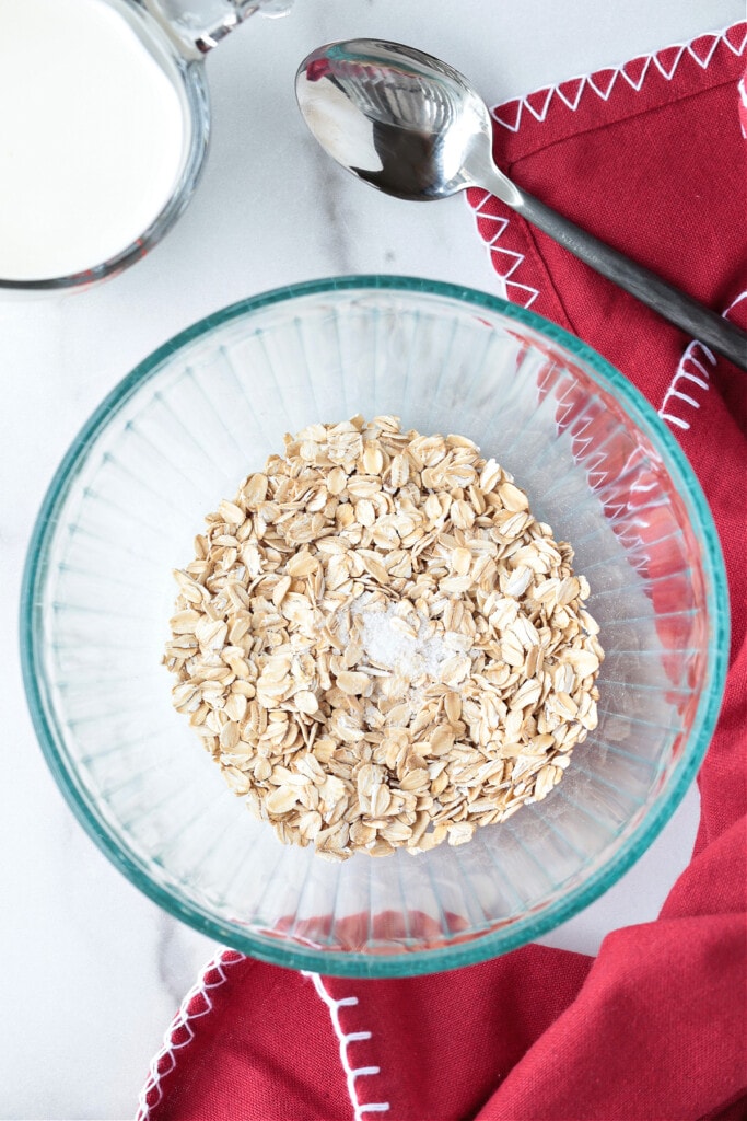 How To Make Oatmeal In The Microwave for the best flavor and texture. A hearty, delicious breakfast that's ready to go in just 5 minutes. oats and salt in a bowl with spoon on the side