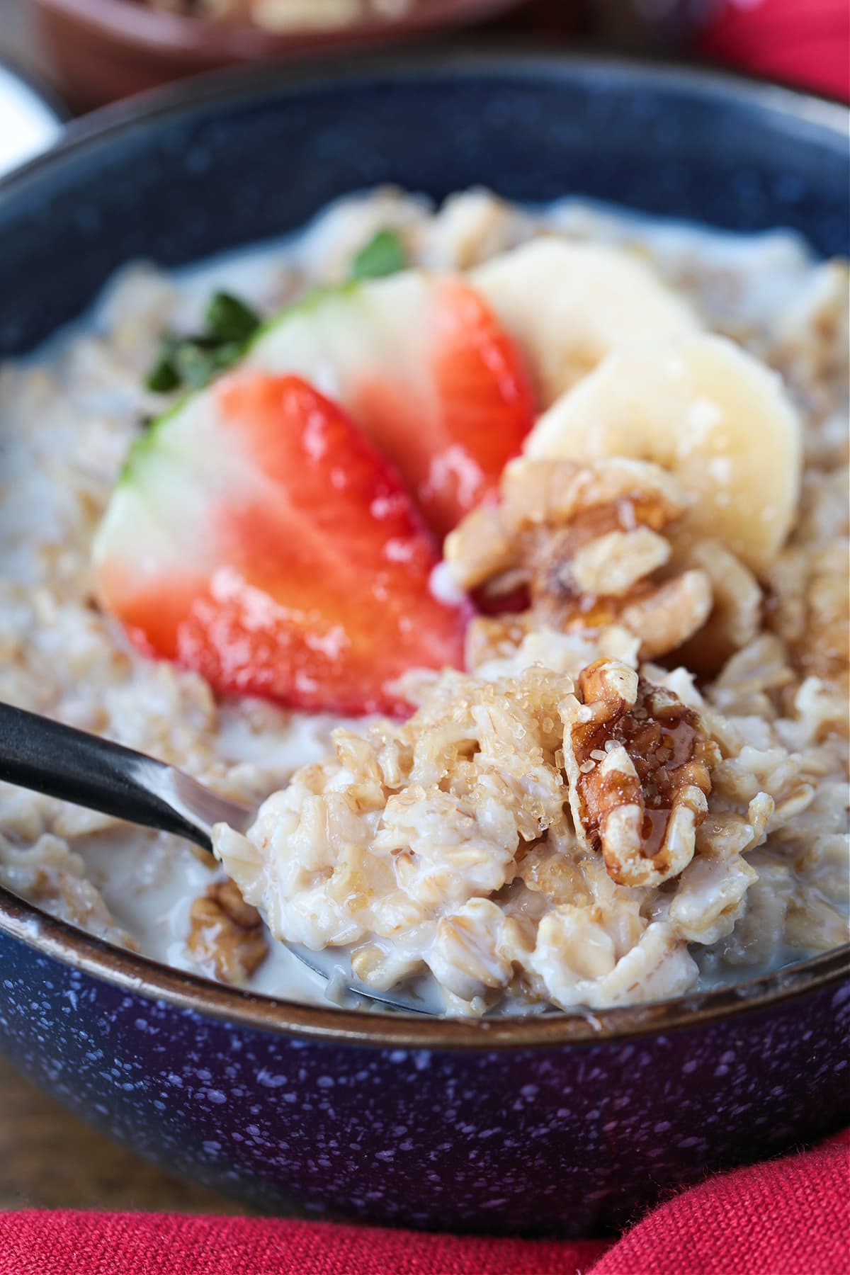 oatmeal in a bowl with a spoon on the side
