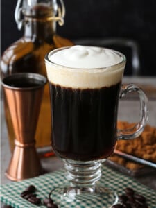 irish coffee in glass mug with whipped cream