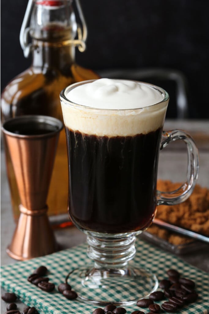 irish coffee in glass mug with whipped cream
