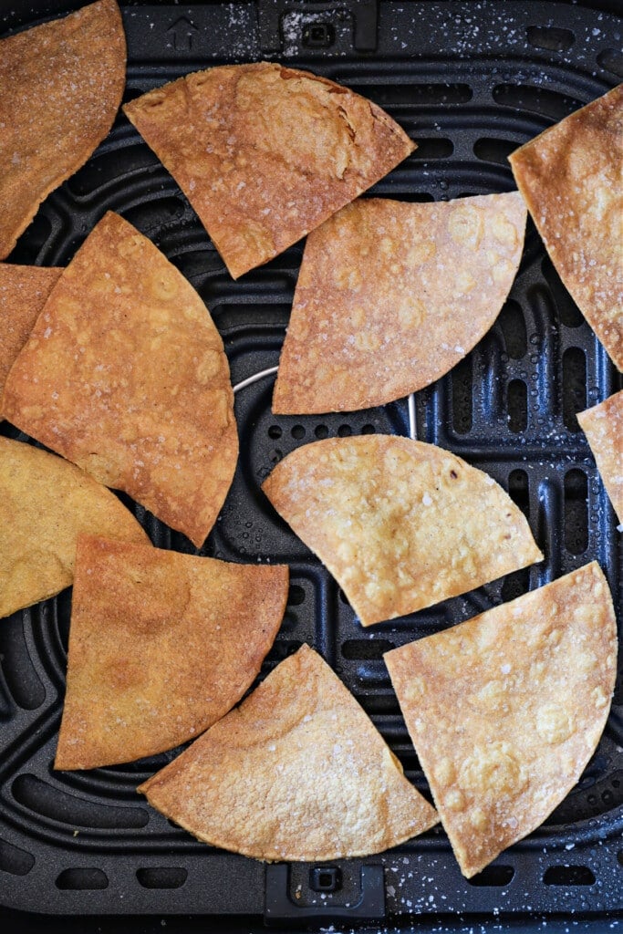These Air Fryer Tortilla Chips are super crispy and so addicting! Dip them in salsa, serve them with soups or make a platter of nachos! air fried corn tortilla chips