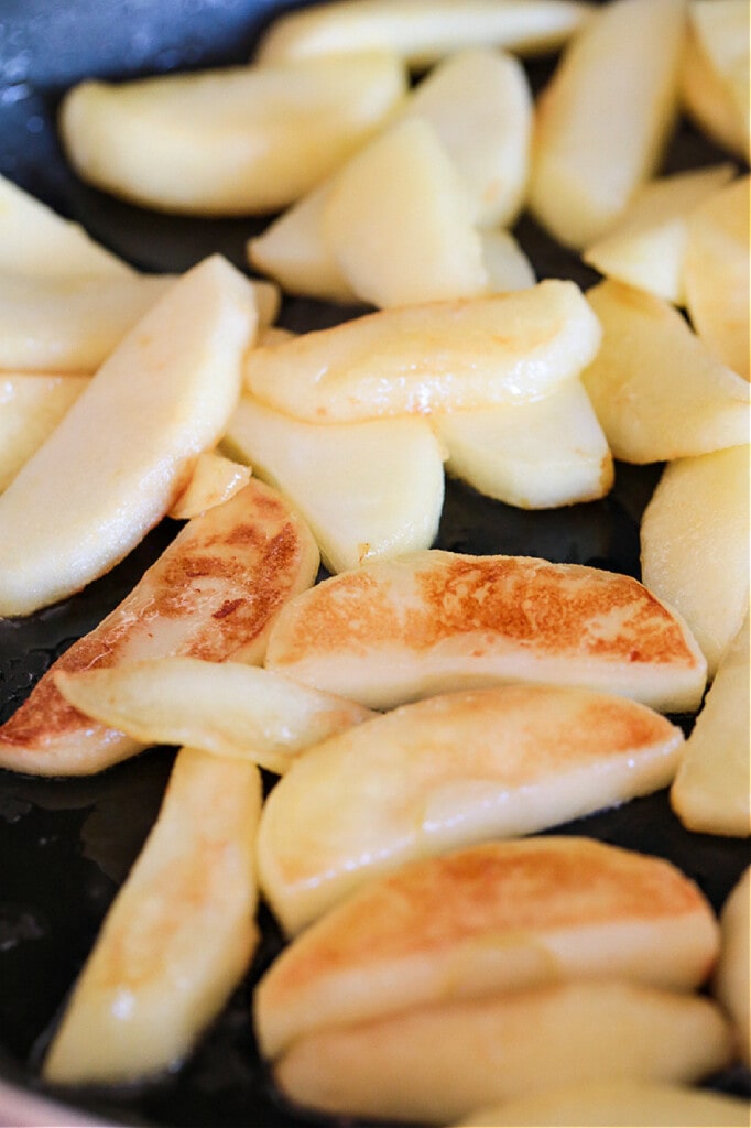 apple slices in skillet browning with butter