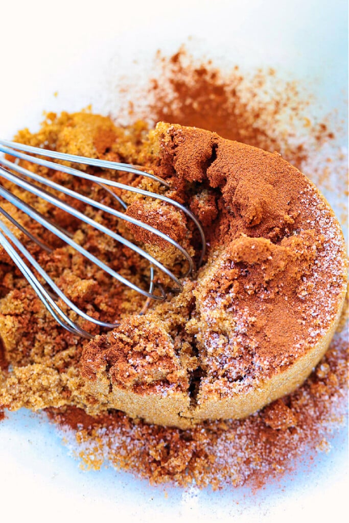 brown sugar and cinnamon in bowl with whisk