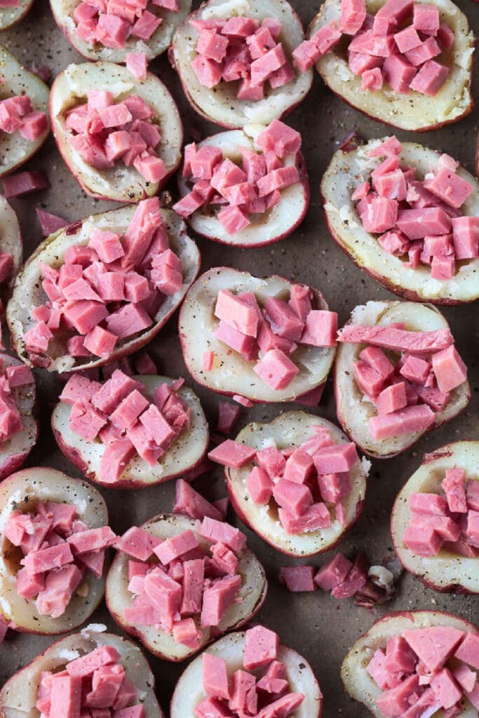 Corned Beef Stuffed Potatoes are a tasty way to use leftover corned beef! Tender baby potatoes stuffed with corned beef and cheddar cheese! potatoes stuffed with diced corned beef