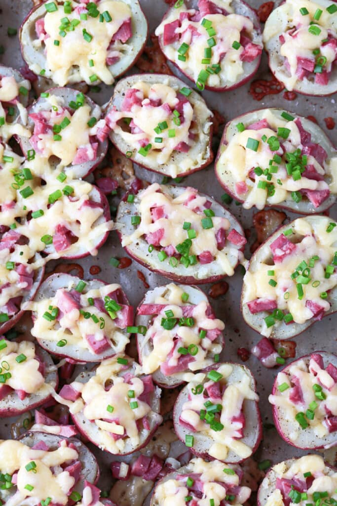 Corned Beef Stuffed Potatoes are a tasty way to use leftover corned beef! Tender baby potatoes stuffed with corned beef and cheddar cheese! potato halves stuffed with cheese and corned beef