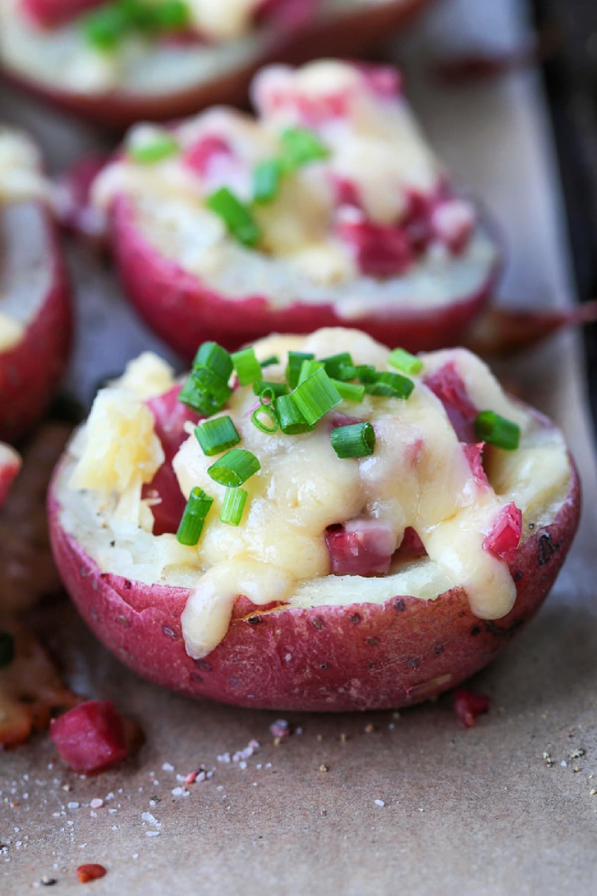 Corned Beef Stuffed Potatoes are a tasty way to use leftover corned beef! Tender baby potatoes stuffed with corned beef and cheddar cheese! mini red potato stuffed with corned beef and cheddar cheese
