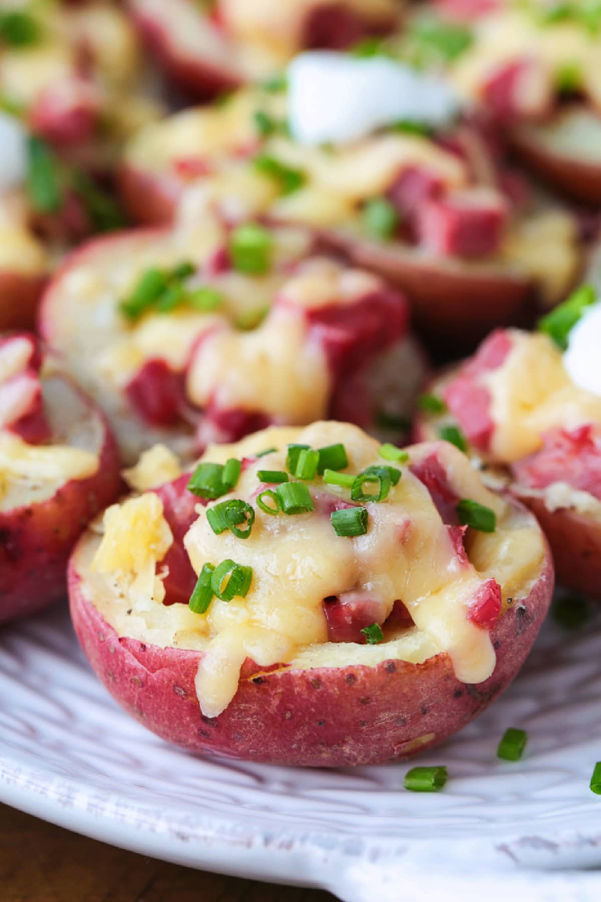 10 Leftover Corned Beef Recipes to transform your leftovers into new, fun and unique recipes. From appetizers to breakfast to dinner ideas! potato halves stuffed with corned beef and cheese