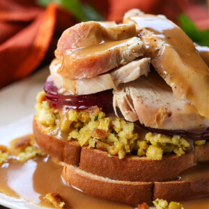 hot turkey sandwich on white plate with gravy