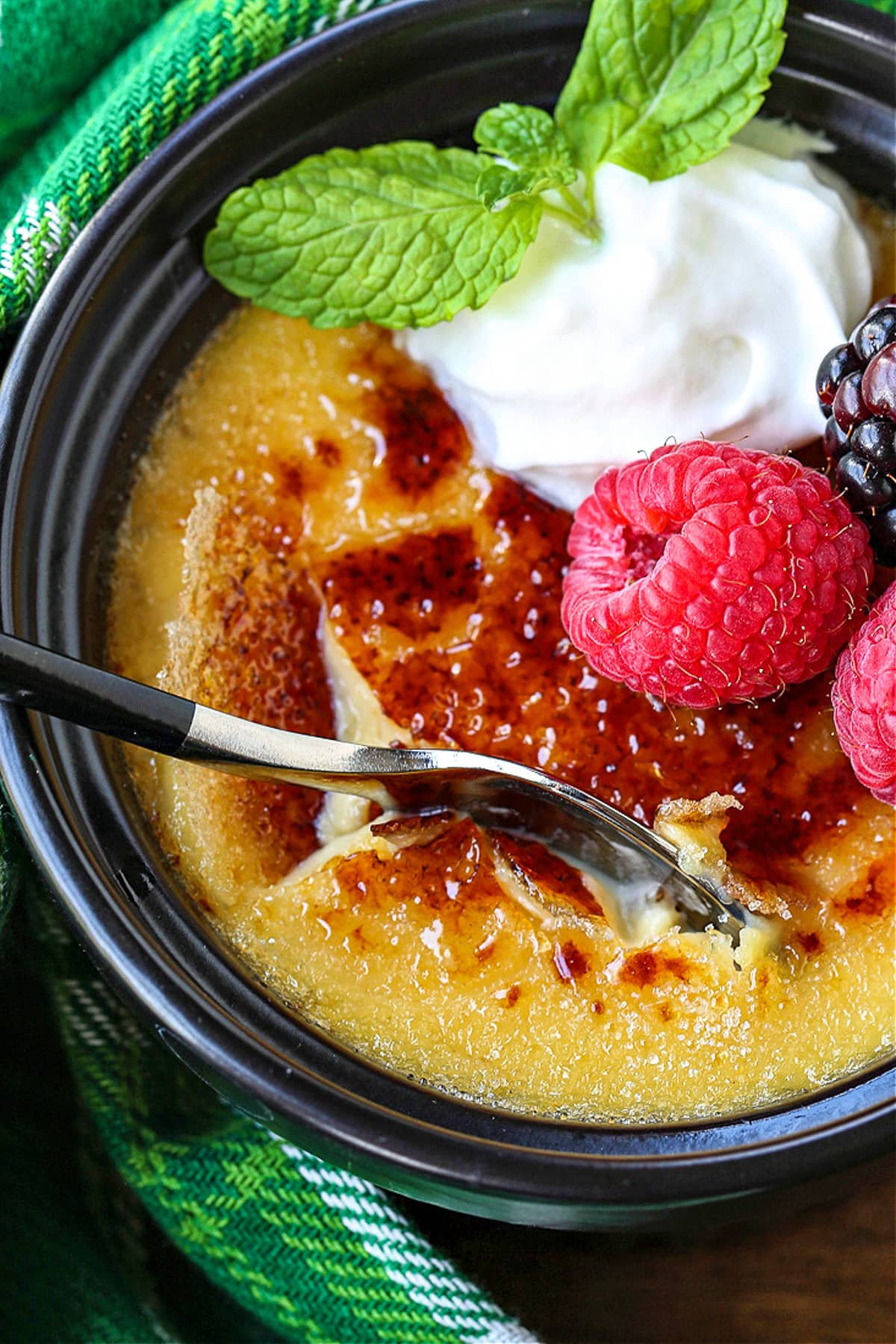 spoon getting a scoop of creme brulee