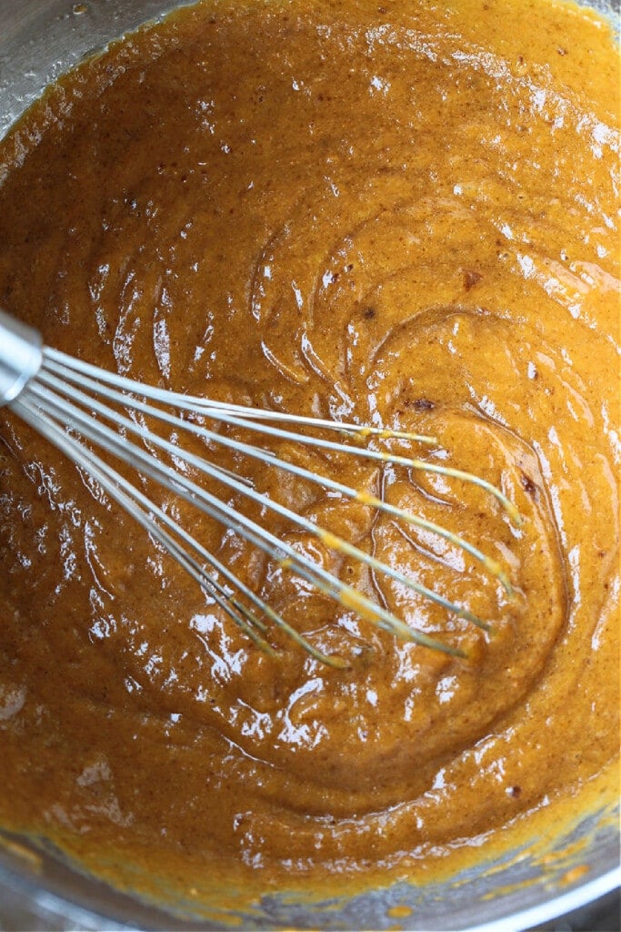 These Pumpkin Chocolate Chip Muffins are so moist and flavorful, made with real pumpkin puree. Enjoy them for breakfast, dessert or a snack! batter for pumpkin chocolate chip muffins
