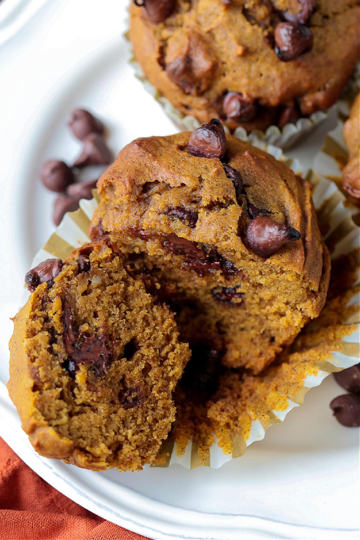 These Pumpkin Chocolate Chip Muffins are so moist and flavorful, made with real pumpkin puree. Enjoy them for breakfast, dessert or a snack! Pumpkin muffin recipe with chocolate chips