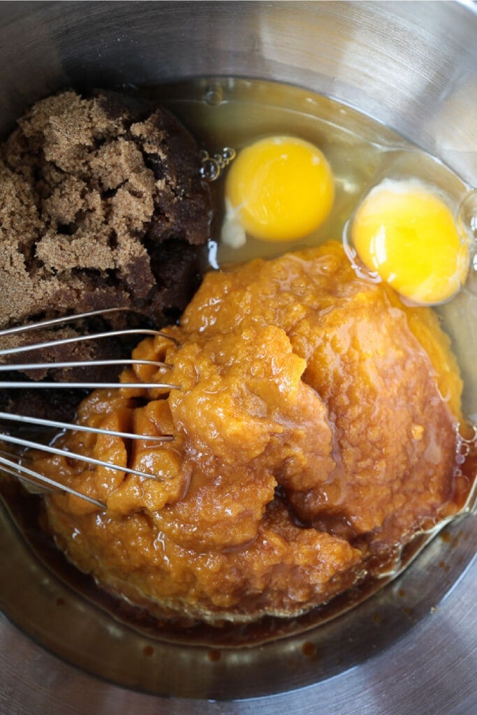 These Pumpkin Chocolate Chip Muffins are so moist and flavorful, made with real pumpkin puree. Enjoy them for breakfast, dessert or a snack!