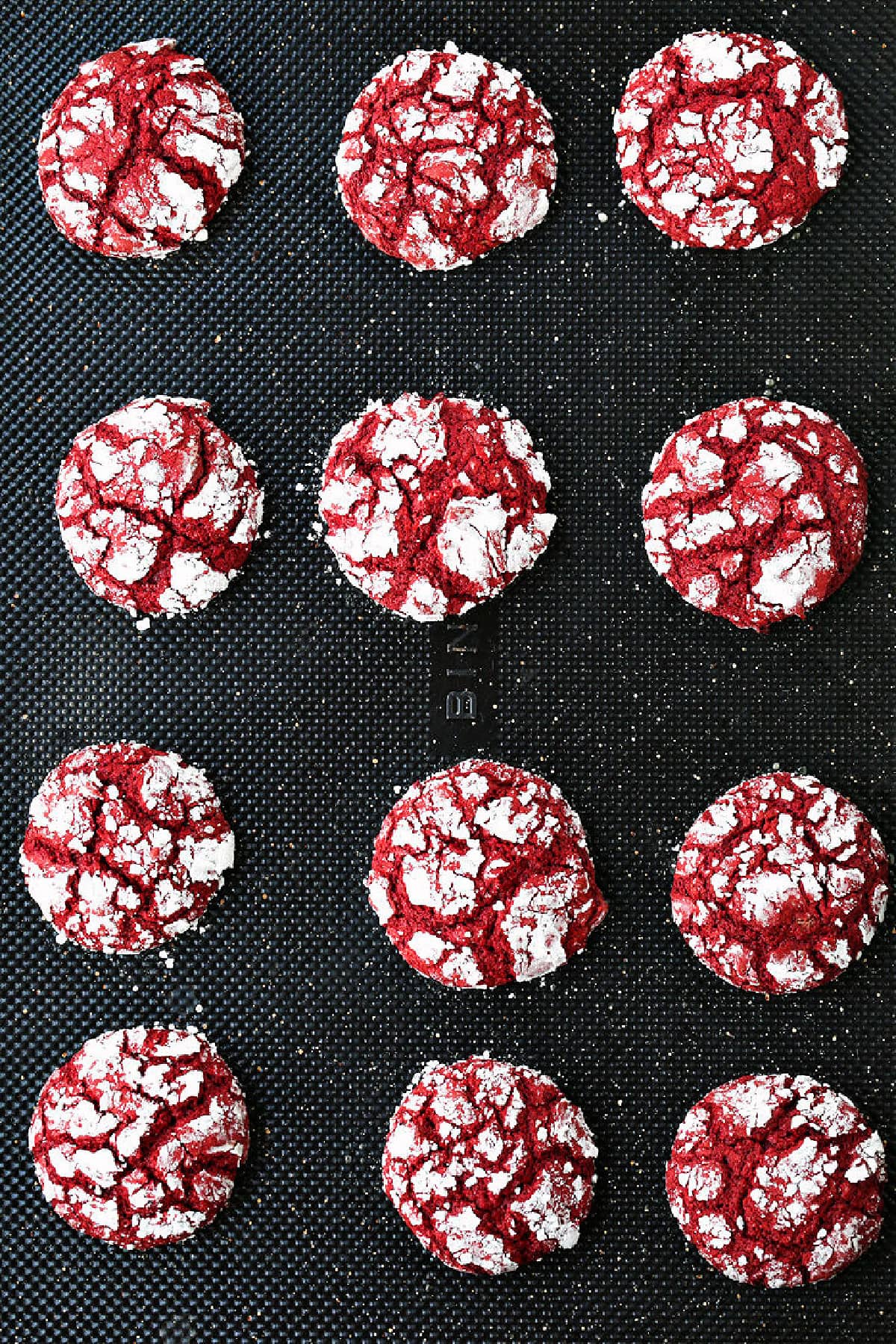 red crinkle cookies on baking sheet