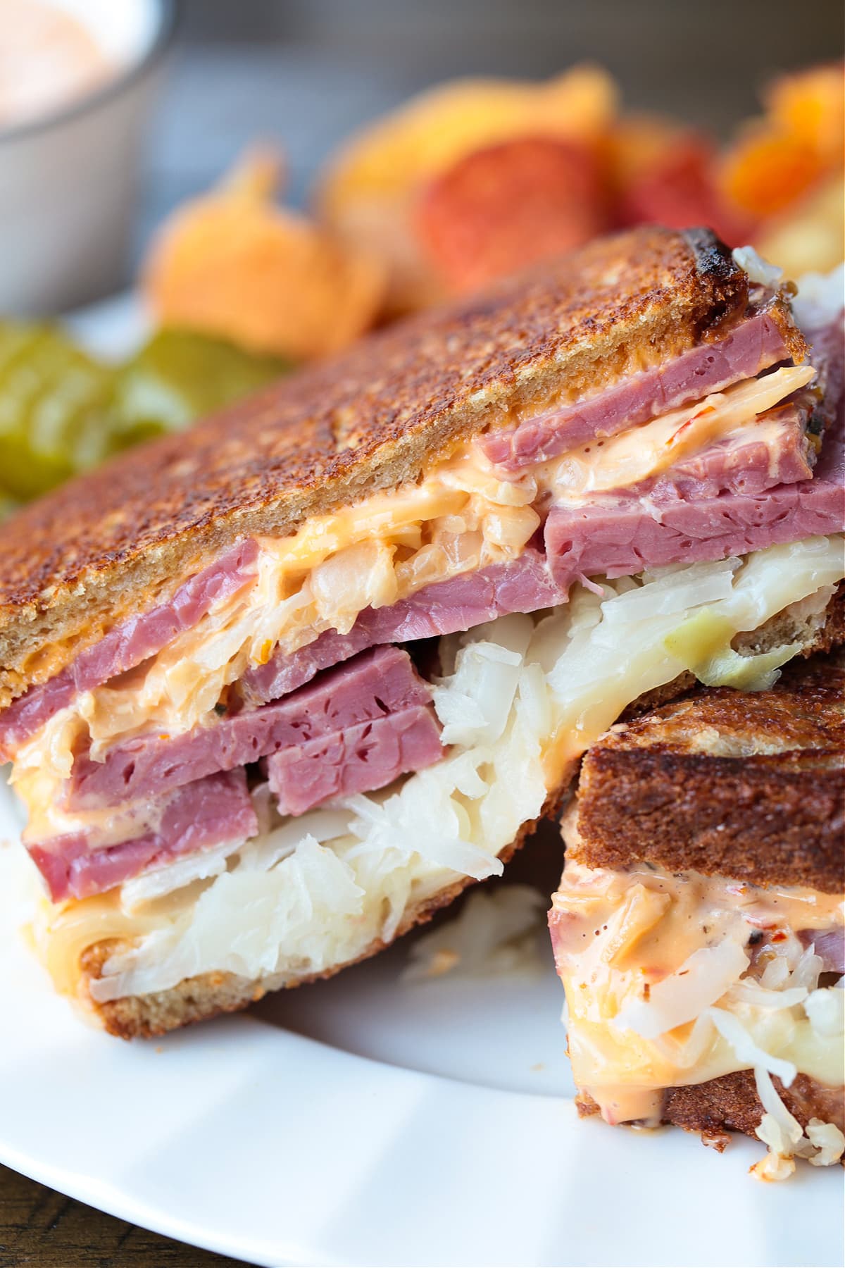 sliced reuben sandwich on a plate