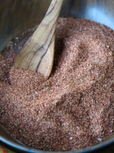fajita seasoning in wooden bowl with wooden spoon