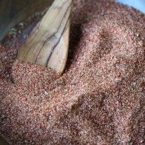 fajita seasoning in wooden bowl with wooden spoon