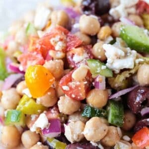chickpea salad with feta cheese on white plate