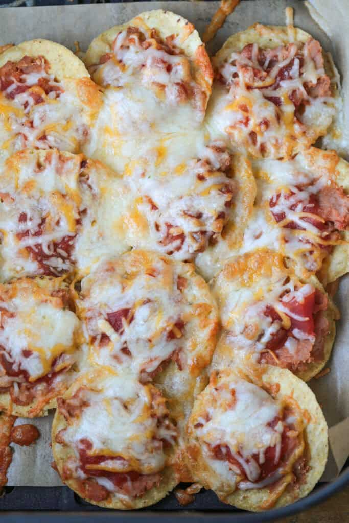 Air Fryer Nachos are so easy to make your kids can do it on their own. Ready in just 5 minutes for after school snacks, appetizers or dinner! nachos in air fryer after cooking