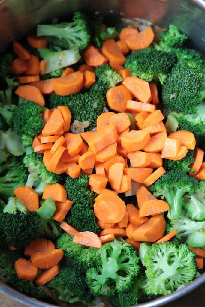 carrots and broccoli in soup pot