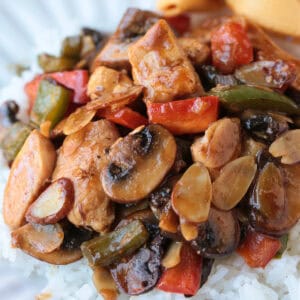 chicken stir fry on a plate with fortune cookies