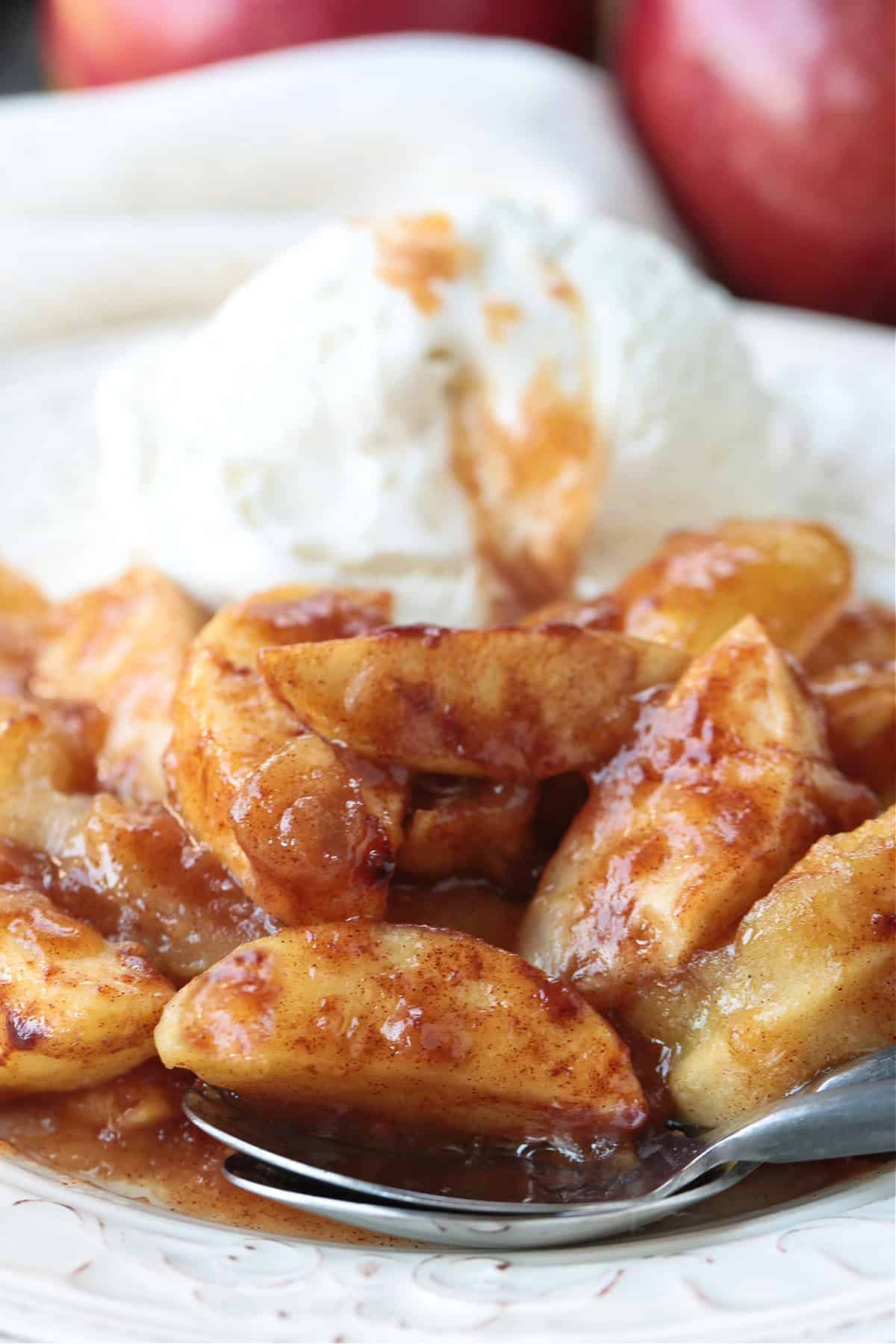 An easy, but dazzling dessert! Baked Sliced Apples are so delicious spooned over ice cream or served with whipped cream on the side. baked apples with ice cream on the side