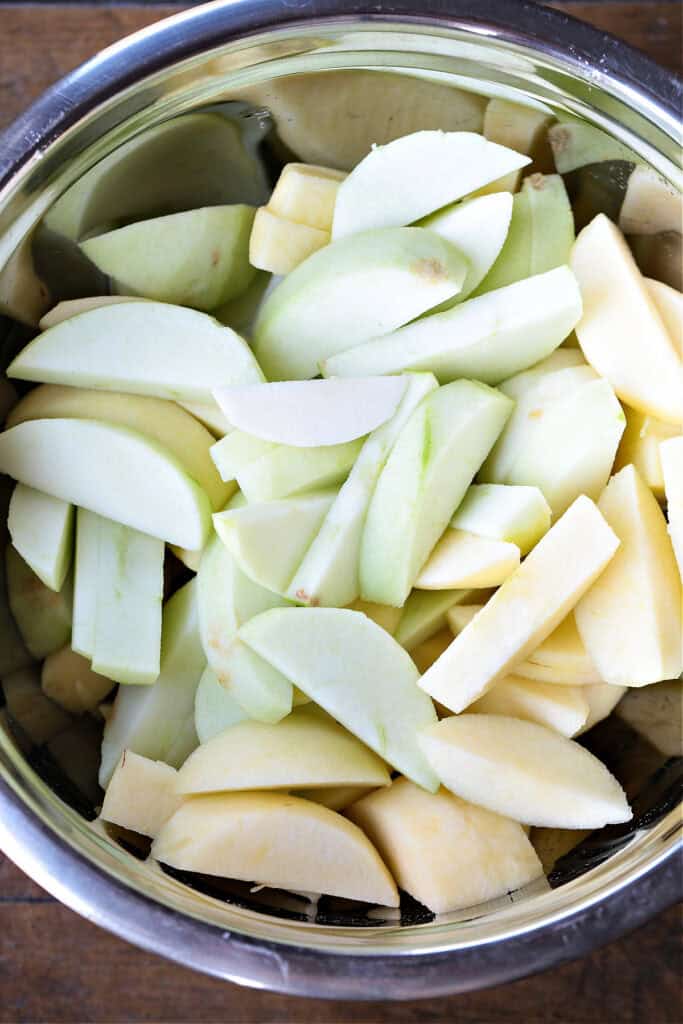 An easy, but dazzling dessert! Baked Sliced Apples are so delicious spooned over ice cream or served with whipped cream on the side. peeled, sliced apples in a bowl