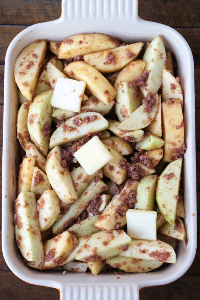 An easy, but dazzling dessert! Baked Sliced Apples are so delicious spooned over ice cream or served with whipped cream on the side. sliced apples tossed in brown sugar and cinnamon in a baking dish