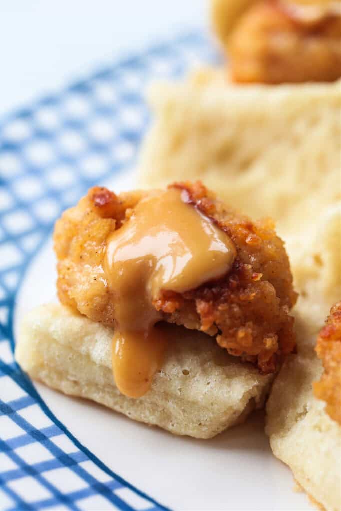Make these Copycat Chicken Minis for your next party or game day! Just like the Chick Fil A version only better because they're homemade! chicken nugget slider with suce