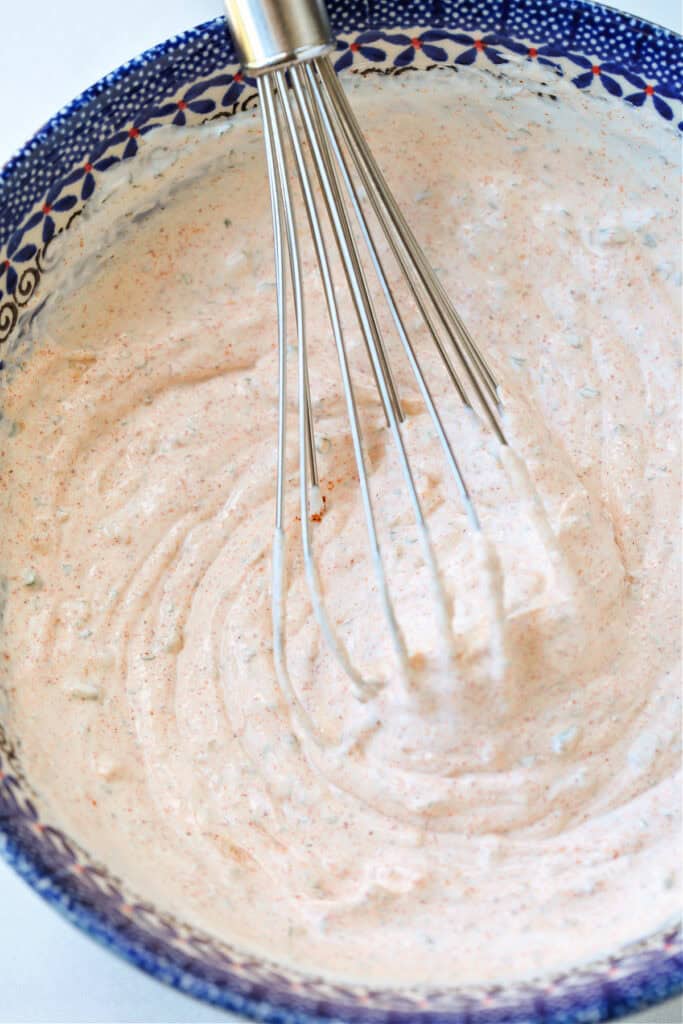This Sour Cream Dip is a party appetizer staple! Perfect for dipping chips, pretzels and veggies, everyone will be asking for the recipe! dip in bowl with whisk