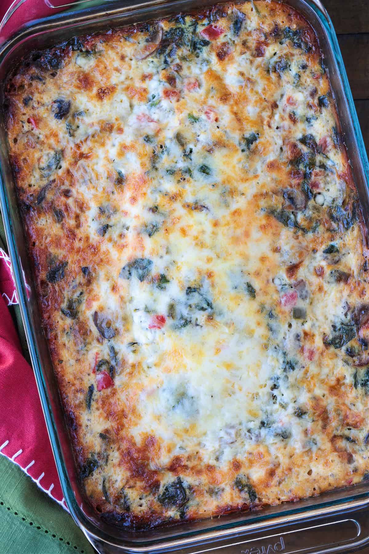 This Italian Breakfast Casserole is delicious for brunch or dinner with a salad! We love this cozy and hearty casserole any time of the day! cooked egg casserole from top