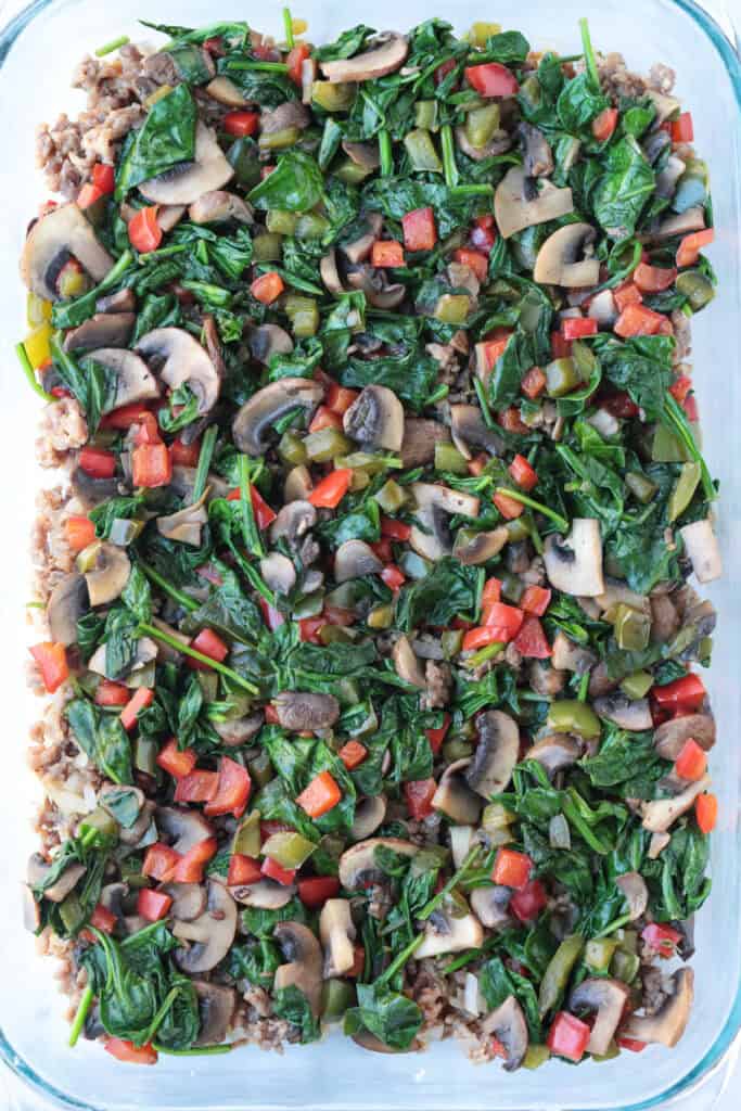 This Italian Breakfast Casserole is delicious for brunch or dinner with a salad! We love this cozy and hearty casserole any time of the day! vegetables in a glass casserole dish