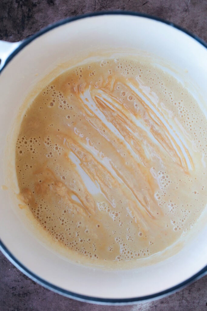 This homemade turkey gravy from drippings only takes minutes to make! A creamy, thick, delicious gravy recipe for your entire turkey dinner! butter and flour in a pot to make roux