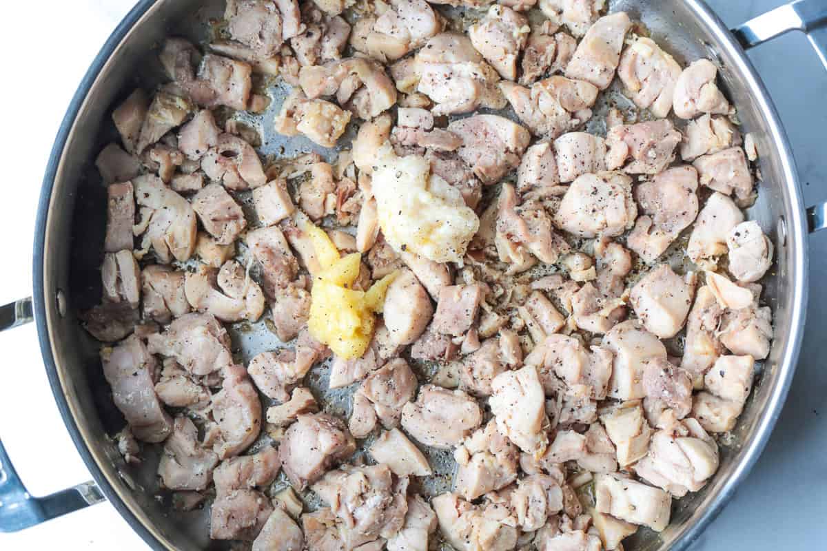 Our Easy Bourbon Chicken is a family favorite dinner recipe! Tender chicken in a sweet and tangy sauce with just a splash of bourbon. cooked diced chicken with garlic and ginger paste