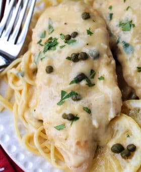 chicken piccata on plate with forks