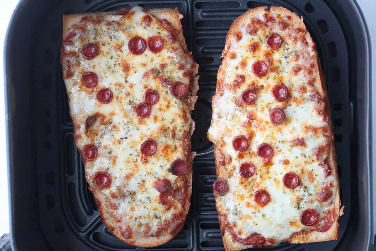 This Air Fryer French Bread Pizza is crispy, cheesy perfection! Ready in minutes, it’s an easy weeknight dinner, quick lunch or snack. french bread pizzas in air fryer