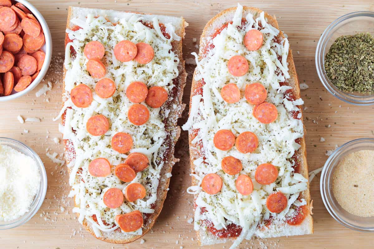 This Air Fryer French Bread Pizza is crispy, cheesy perfection! Ready in minutes, it’s an easy weeknight dinner, quick lunch or snack. mozzarella cheese and pepperoni on bread