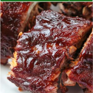 cut bbq ribs on a plate with text overlay for pinterest