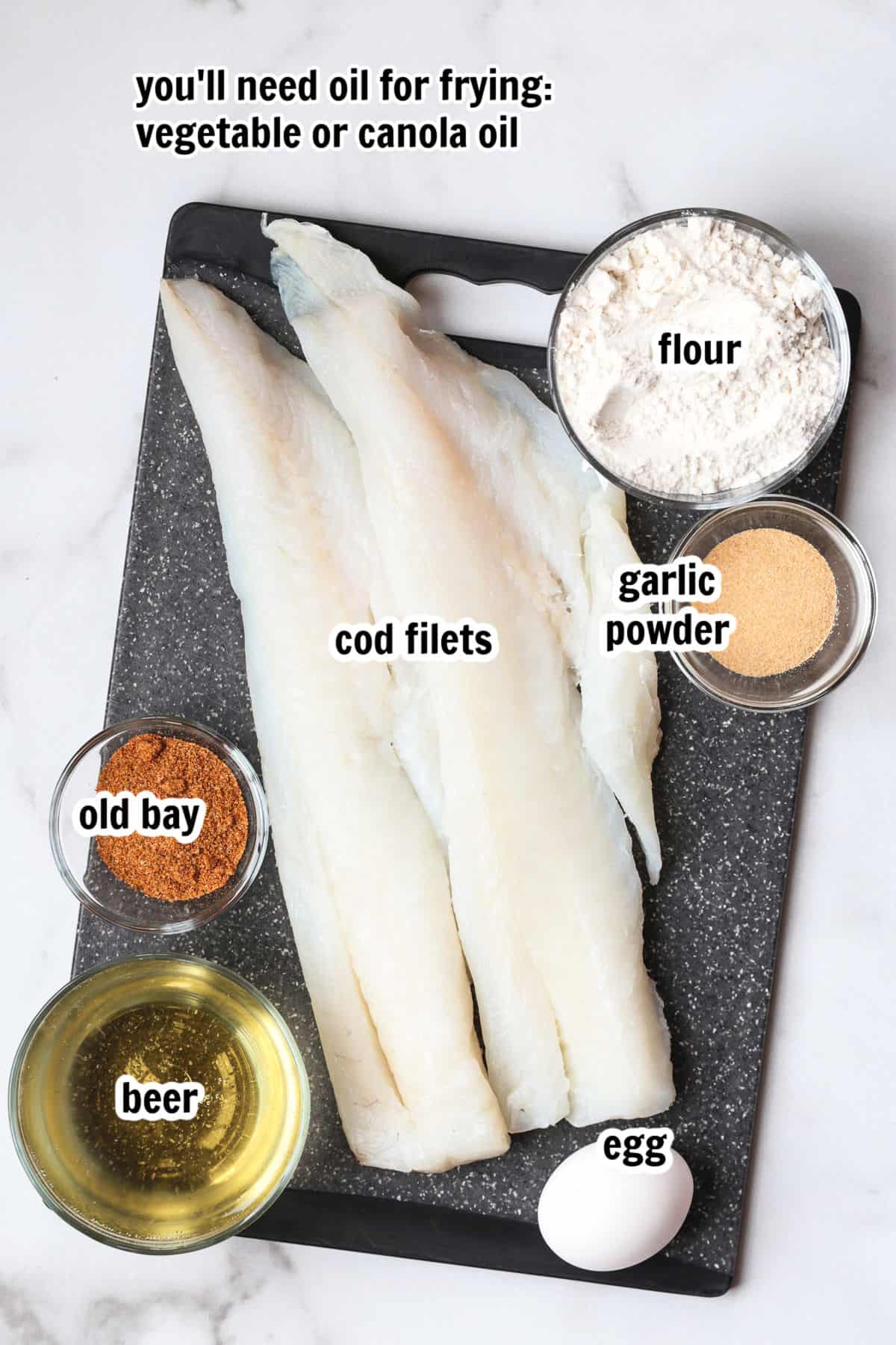 Make crispy, golden beer battered cod at home with our easy recipe! Flaky cod coated in a light beer batter and fried to a crispy perfection. ingredients on board for making beer battered cod