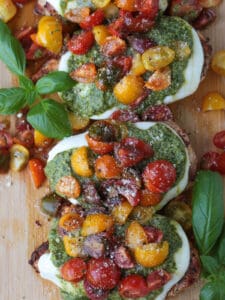 chicken margherita on a board with basil