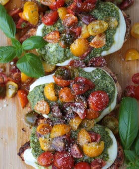 chicken margherita on a board with basil