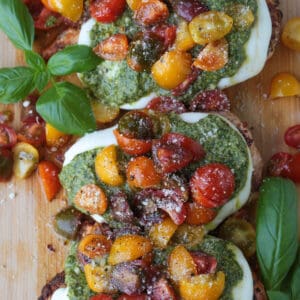 chicken margherita on a board with basil