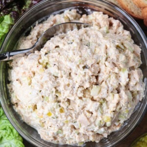 chicken salad in a glass bowl with spoon