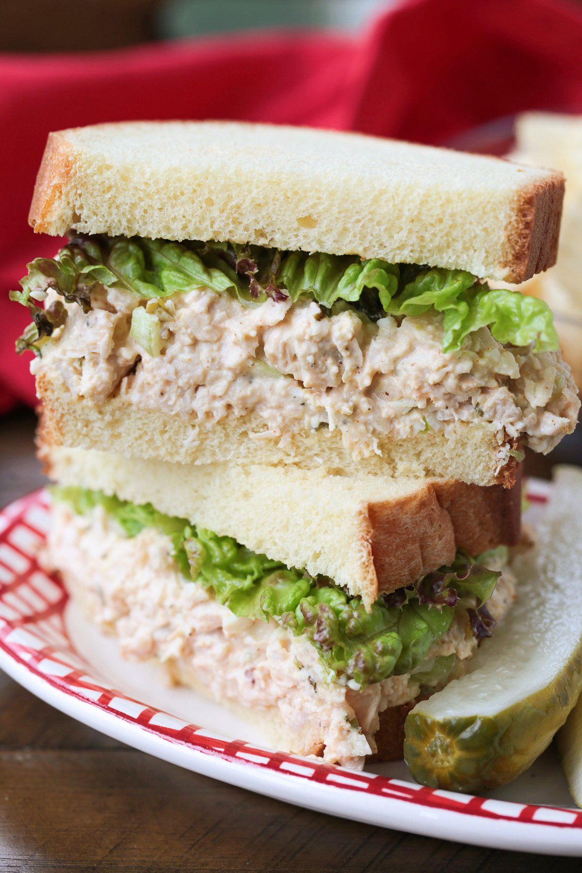chicken salad sandwich with lettuce cut and stacked