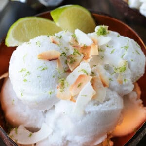 coconut sorbet in bowl with limes