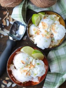 two bowls of coconut sorbet with scooper in background