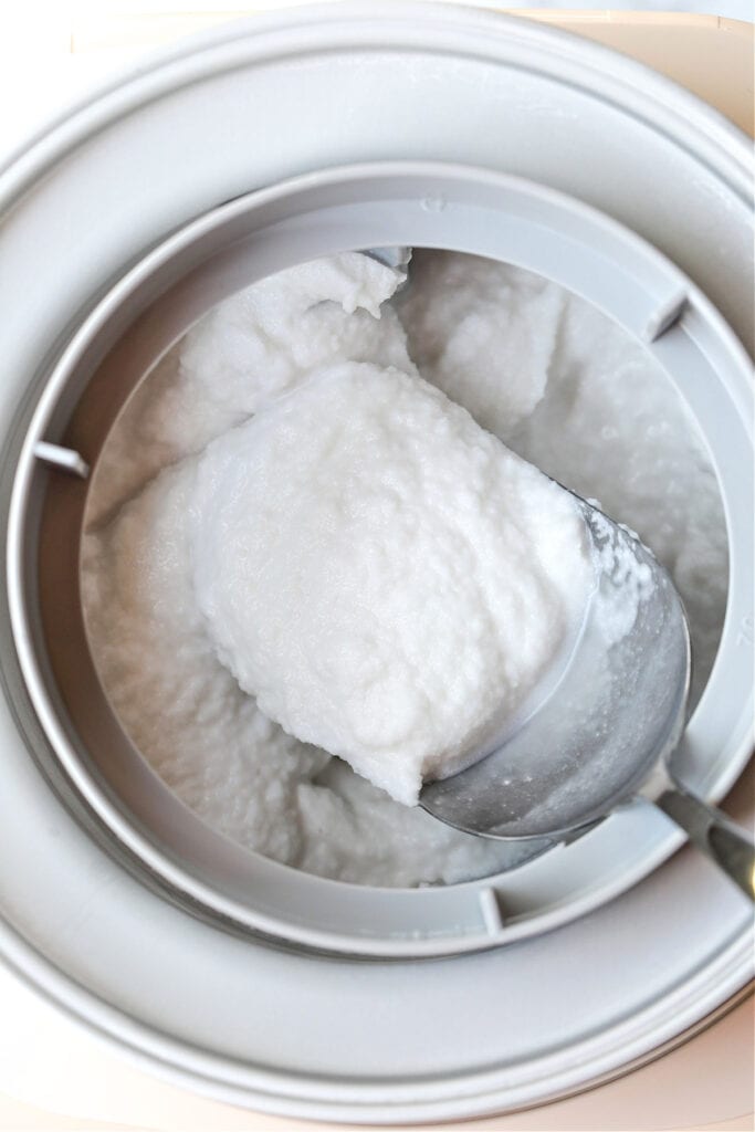 This homemade coconut sorbet is bursting with tropical flavor! Made with coconut milk and simple ingredients for a refreshing summer dessert. sorbet in an ice cream maker