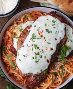 chicken parmesan on a bed of spaghetti