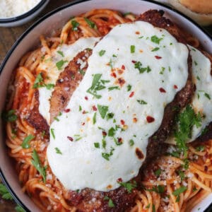 chicken parmesan on a bed of spaghetti