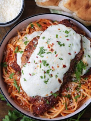 chicken parmesan on a bed of spaghetti