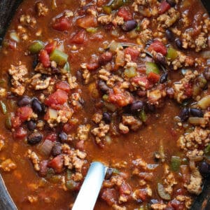 turkey chili in a slow cooker with ladle